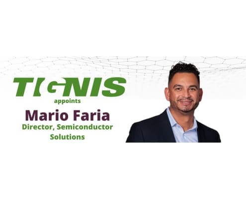 Man smiling wearing a light blue collared shirt and a black suit jacket. To the left reads 'Tignis appoints Mario Faria Director, Semiconductor Solutions'